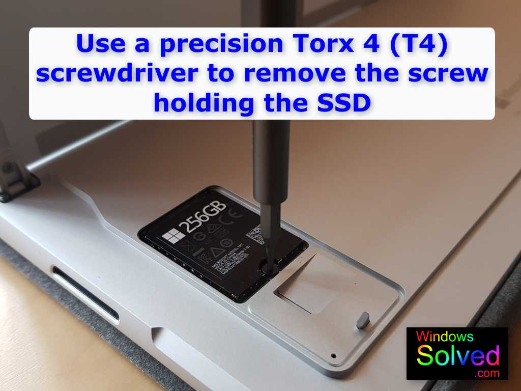 Use a Torx 4 (T4) precision screwdriver to remove the tiny screw holding the SSD in your Surface Pro 8.